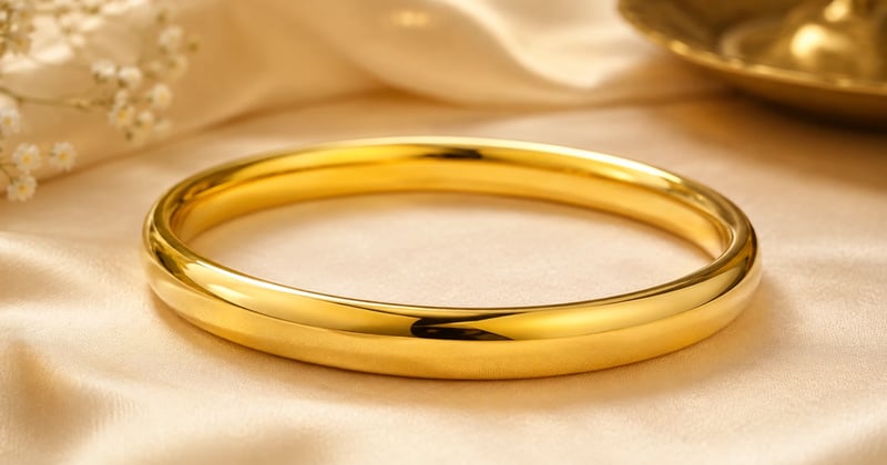 A gold kada for gents placed nicely on the cloth