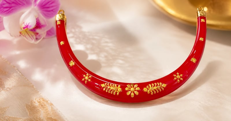 Gold pola necklace with deep red beads and carved gold caps