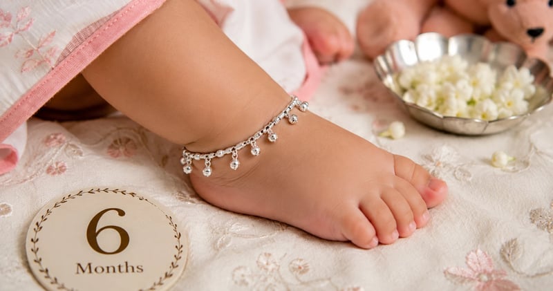 Baby silver anklet worn on a six-month-old's ankle for scale